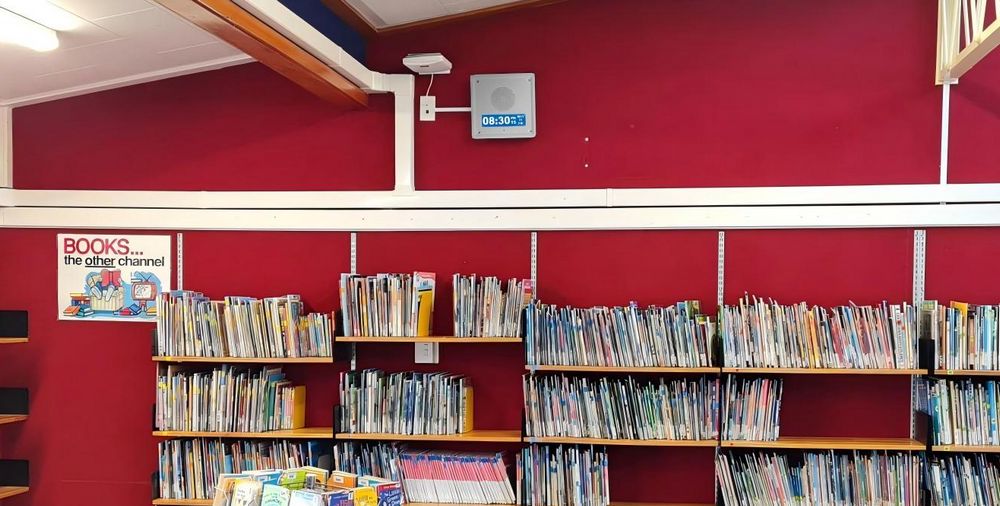 ZYCOO SQ10-T wall-mount IP speaker with LCD display in classroom